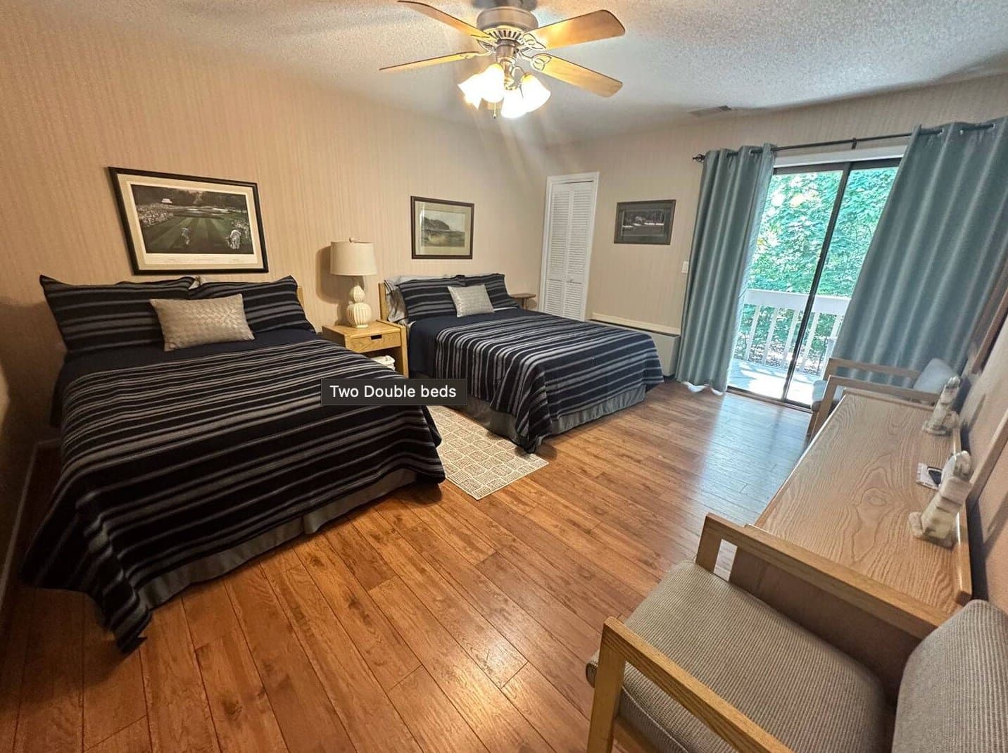 Second bedroom with two double beds and balcony